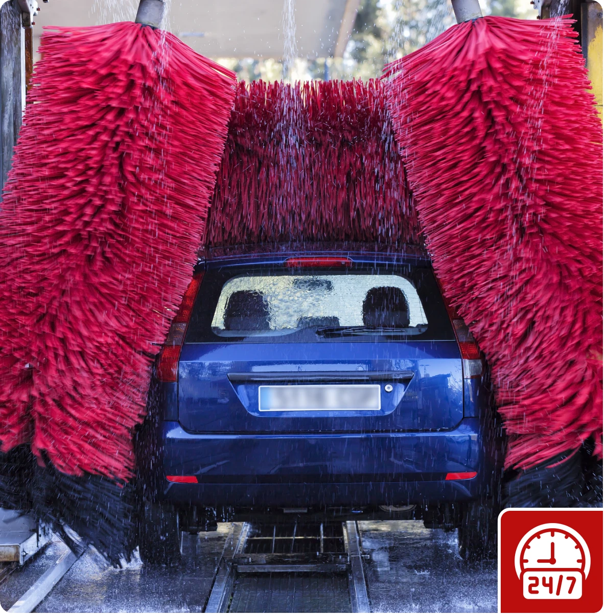 Blue vehicle getting washed at car wash
